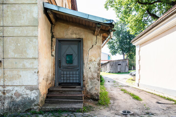 Old Weathered Wooden Door Entrance with Small Canopy