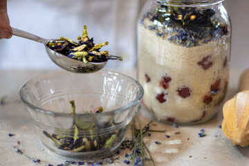 Measuring Butterfly Pea Flowers Beside Jarred Fruit and Lavender