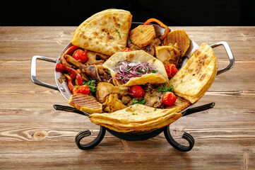 meat with lavash, herbs and grilled vegetables