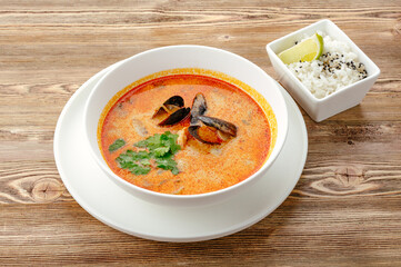 Tom yum soup with mussels and rice