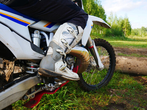 Motocross Ride: Rider's Boot and Bike Ready for Action