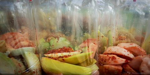 Assortment of plastic bag food of fruit sold in the market in Thailand 