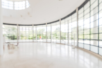 Hotel or office building lobby blur background interior view toward reception hall, modern luxury...