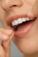 Daily dental care routine highlighting flossing technique for optimal oral hygiene