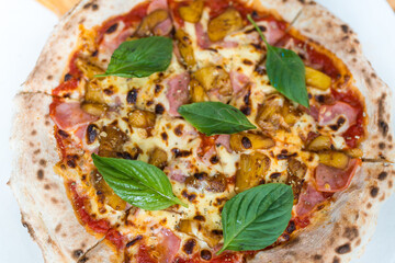 Close up Hawaiian pizza with thai herbs