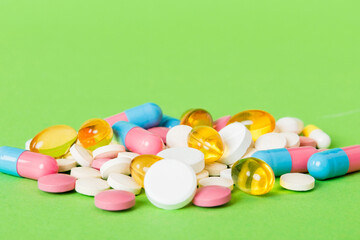 Many different colorful medication and pills perspective view. Set of many pills on colored...