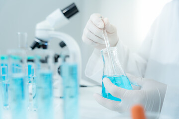 Scientist analyze biochemical samples in advanced scientific laboratory. Medical are mixing chemicals to test physical properties of cosmetic. develop viral. Biotechnology research in science lab.