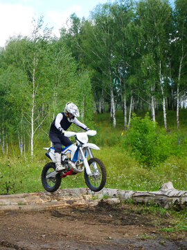 Dirt Bike Thrills: Overcoming Log Obstacles