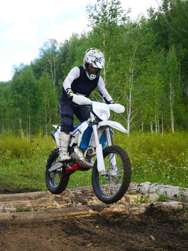 Dirt Bike Jumper: Clearing Logs in the Forest