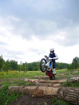 Enduro Rider man Conquering Logs