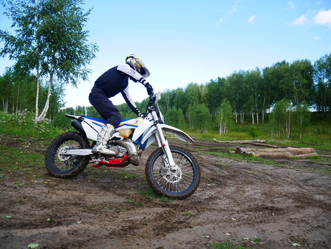 Dirt Bike Rider on Muddy Trail