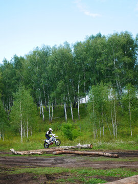 Enduro Rider Tackles Log Obstacle