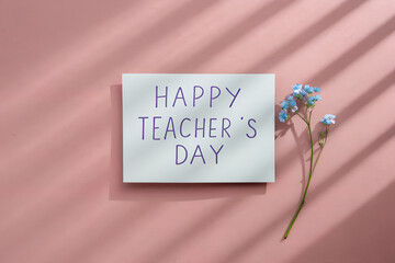 Happy Teacher's Day Card with Blue Flowers on Pink Background for Classroom, Greeting, Appreciation or Celebration Design