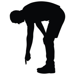 Man bending down pointing at the ground silhouette