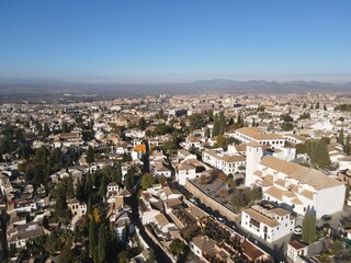 Obraz premium Golden Fall Drone View of Alhambra – Sunlit Fortress in Granada, Spain