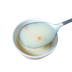 A curated collection of wholesome and savory cream soup with a spoon in a bowl.

