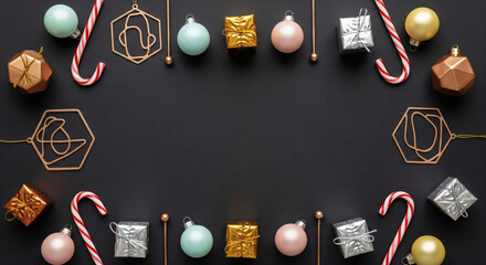 A Festive Frame or Border with Geometric Christmas Ornaments, Candy Canes, and Metallic Gift Boxes on a Dark Background with Copy Space