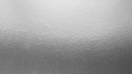 Silver background foil leaf metallic texture wrapping paper shiny glowing white grey solid reflective gradient color metal pattern backdrop for wallpaper decoration element backdrop