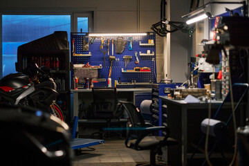 Industrial garage workspace with tools and equipment on working table