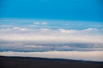 An elevated view from the summit of Mauna Kea on the Big Island of Hawaii, photographed above the clouds in one of the island’s most remote and scenic locations.