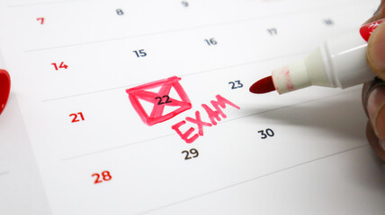 A calendar with the number 22 crossed out in red and 