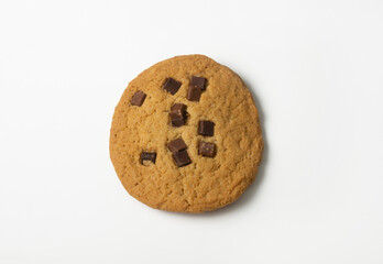 One large craft chocolate chip cookie on white background. Flat lay