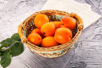 Raw ripe sweet apricots heap