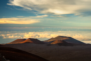 A dreamy scene above the clouds from the summit of Mauna Kea, Hawaii, at sunrise.
