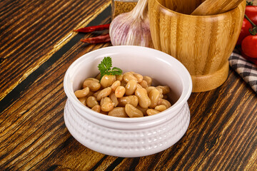 Baked white canned beans in the bowl