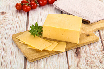 Yellow cheese piece with slices