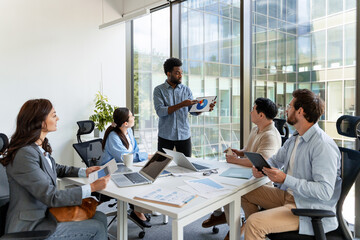 Marketing manager presenting company strategy during a corporate meeting
