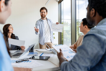 Marketing manager presenting company strategy during a business meeting