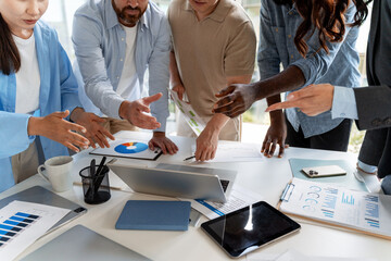 Business team analyzing financial data and discussing marketing strategy