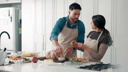 Cooking, home and couple in kitchen with turkey for meal prep, dinner and festive lunch. Thanksgiving, talking and man with woman help with ingredients, recipe and food for nutrition, dish and feast - Powered by Adobe