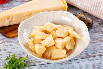 Parmesan cheese pieces in the bowl