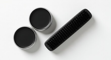 Black Shoe Polish Tins and Brush Isolated on White Background – Footwear Care and Maintenance Kit.