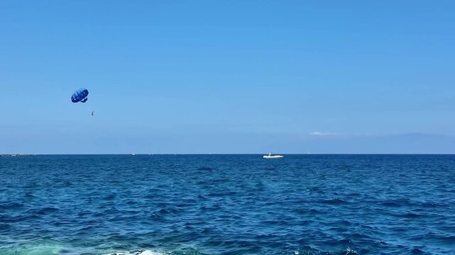 Experience the thrill of parasailing over beautiful blue waters, perfect for adventure lovers seeking excitement