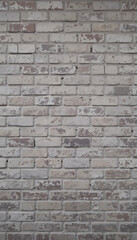 Obraz premium A solid texture of old, weathered red brick wall with a detailed pattern of rough, gray cement