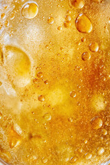 Golden Liquid with Bubbles and Syrup Texture