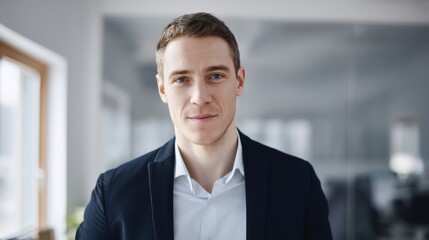 Fototapeta premium A professional man in a business suit and white shirt stands confidently outdoors in front of a modern glass facade,