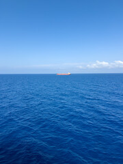 cargo tanker ship in the blue sea vertical