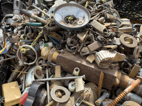 pile of old rusty metal in the Container at the recycling center
