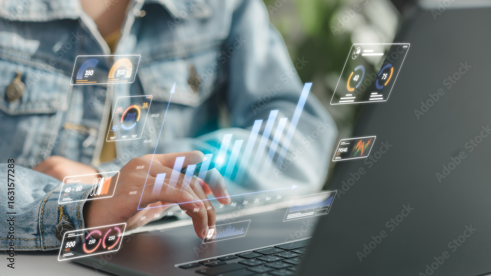 Poster close-up of person using laptop with holographic analytics dashboard showing business charts, kpi me