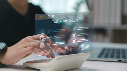 Hand using calculator with online tax form interface, representing digital taxation, e-filing, and...