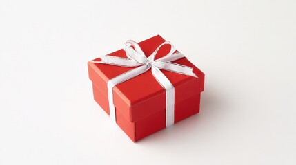 Obraz premium Red gift box with white ribbon and bow, centered product shot on clean background.