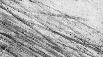 Aerial view car tire marks abstract street road background with black tire marks on race track, Texture and background car automobile and automotive skid tire marks.