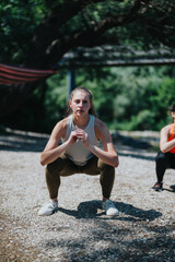 Young friends performs fitness activities outside, showcasing teamwork and healthy lifestyles....