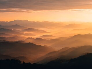 Obraz premium Golden hour sunrise over misty mountain peaks
