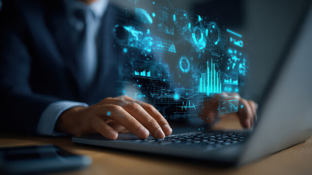 Businessman using laptop with futuristic data analytics, artificial intelligence, and digital technology interface, representing innovation and modern business solutions