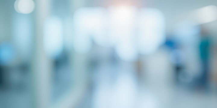 Abstract blur of hospital corridor or clinic interior, bright medical background with light flare for healthcare and science concepts - Powered by Adobe
